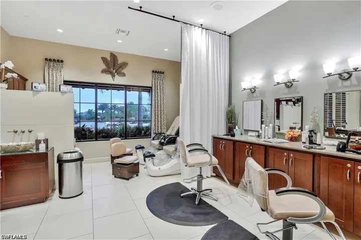 Full bathroom featuring vanity, a tub to relax in, tile patterned flooring, and recessed lighting