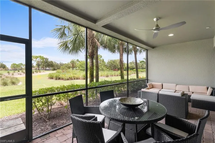 Sunroom / solarium featuring a ceiling fan and an outdoor living space