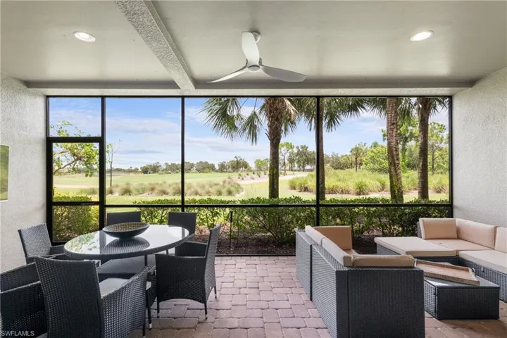 Sunroom featuring a ceiling fan, an outdoor hangout area, outdoor dining area, plenty of natural light, and beamed ceiling