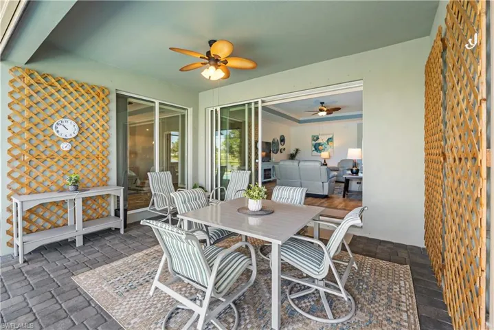 View of patio/ Lanai with outdoor dining area and ceiling fan