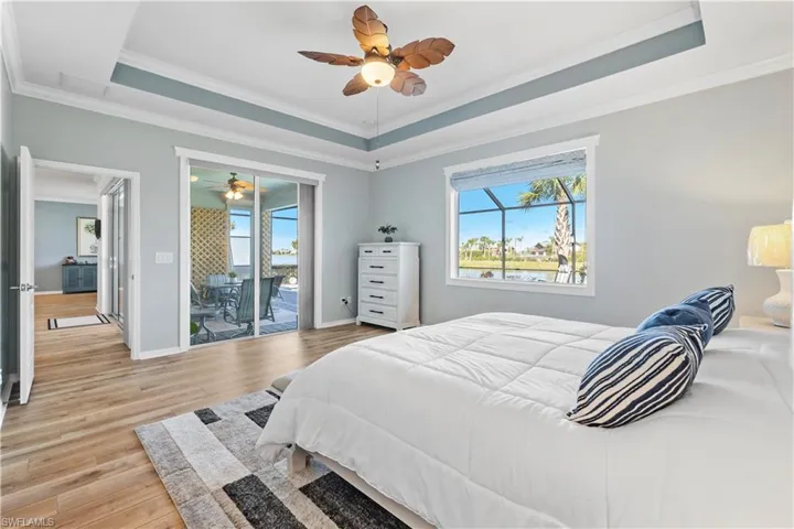 Tray ceiling w/fan. Custom windows and treatments. access to Lanai