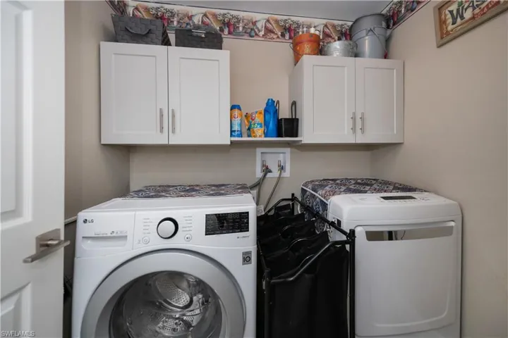 Laundry room with  cabinets
