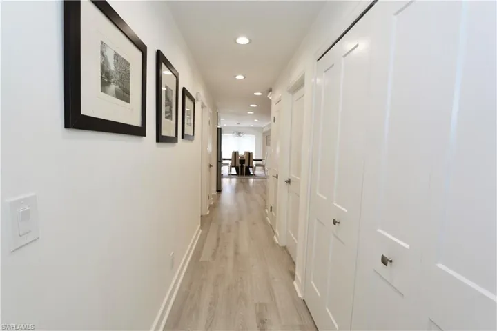 Hall featuring recessed lighting and light wood-type flooring
