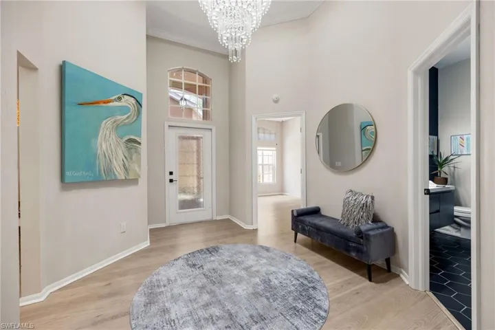 Walk into this grand foyer with tray ceiling, gorgeious crystal chandelier. Home is painted in neutral colors, LVP flooring throughout and tile in bathrooms.