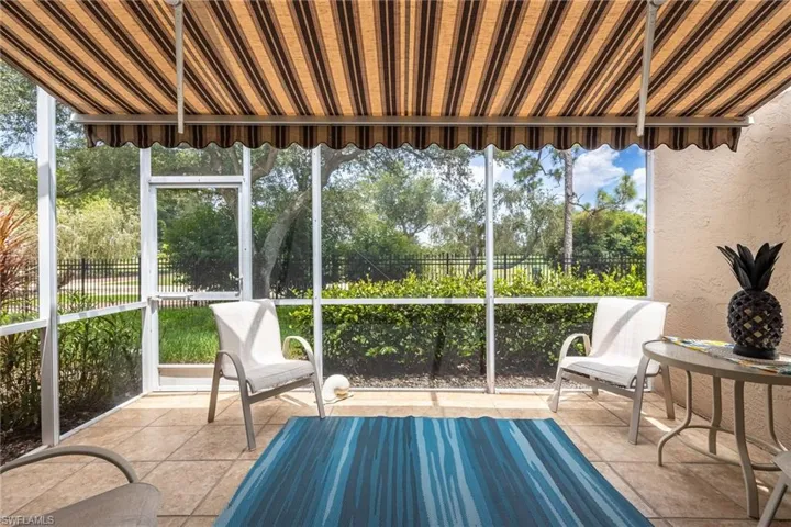 Screened Lanai has an electric awning to give you added shade and year round use of this bonus space.