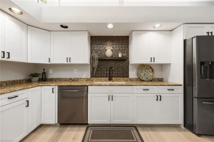 The cabinets have all be refaced, recessed lights added.