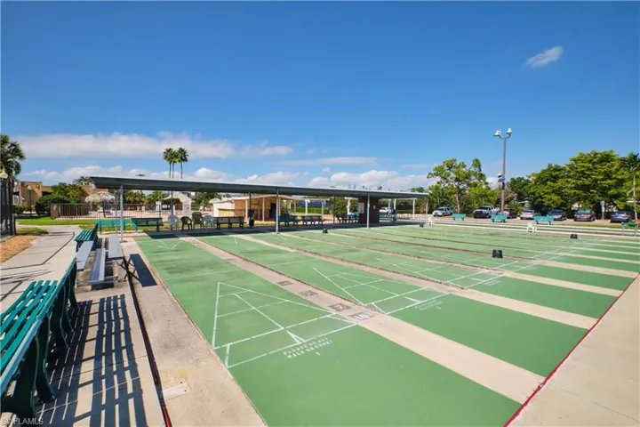 View of community with shuffleboard. Enjoy joining a league.