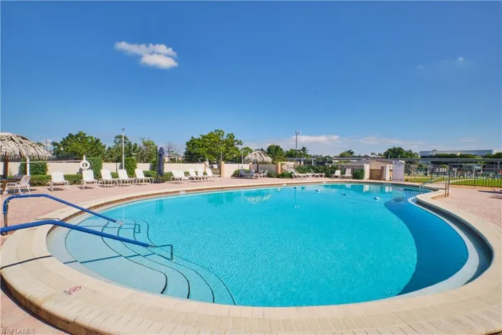 Community pool featuring a patio area.