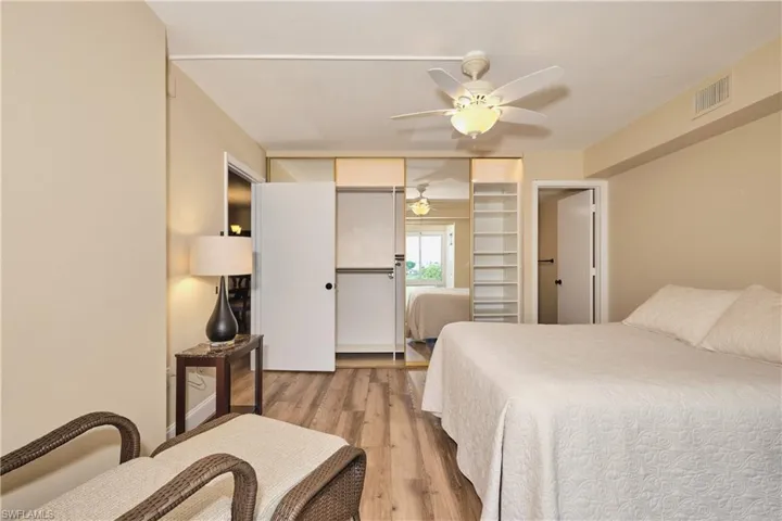 Owner's suite features a lighted ceiling fan, new LVT flooring, custom closet.