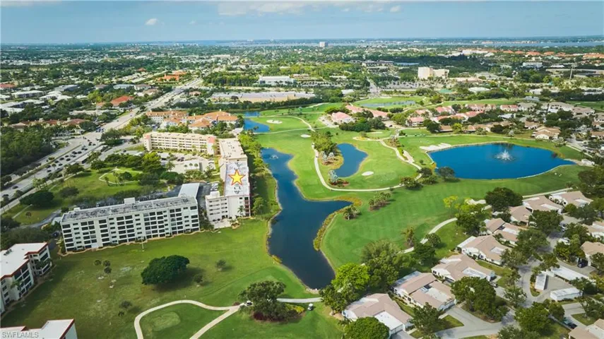 Aerial overview of property's location situated around a golf course and several lovely lakes.