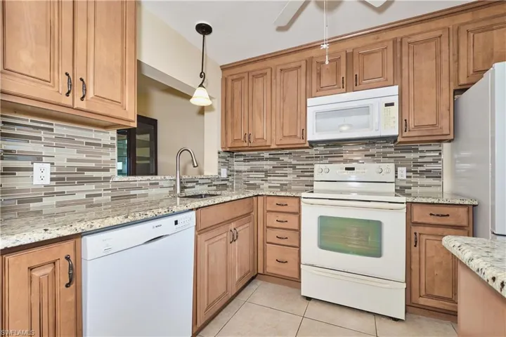 Kitchen features plenty of cabinet and counter top space.