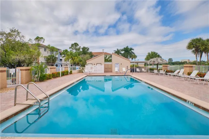 Heated community pool with a patio.