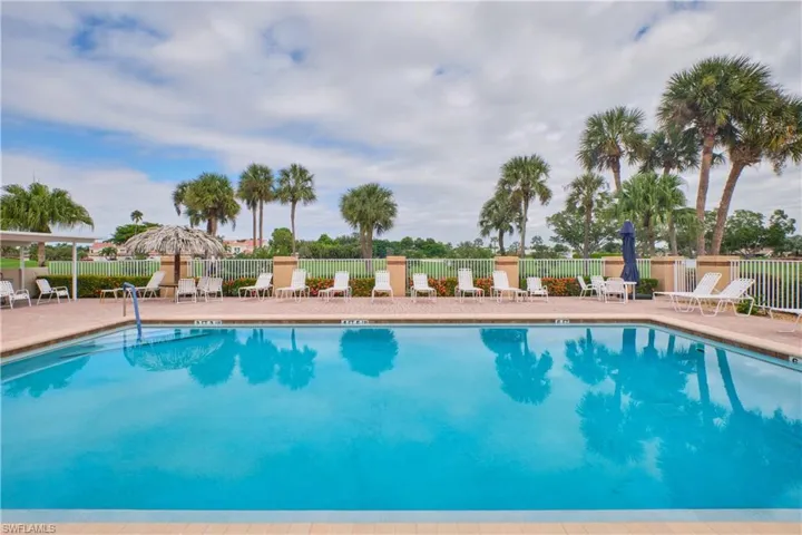 Community pool with a patio