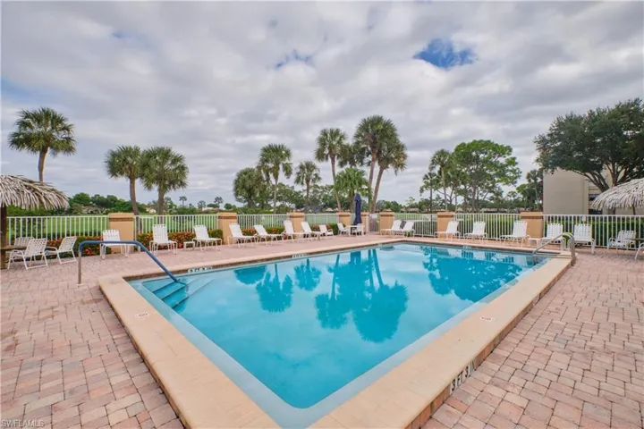 Community pool with a patio area.