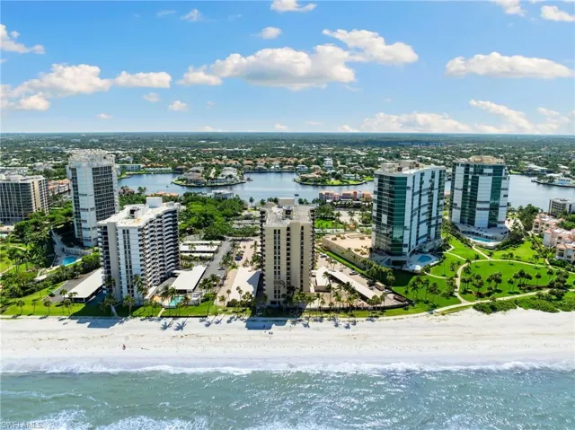 Aerial view with a water view and a view of the beach