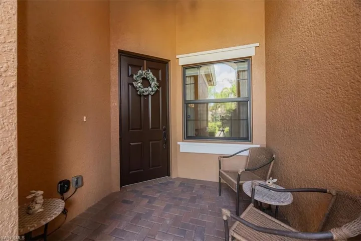 Property entrance with stucco siding