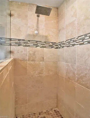 Bathroom with a tile shower