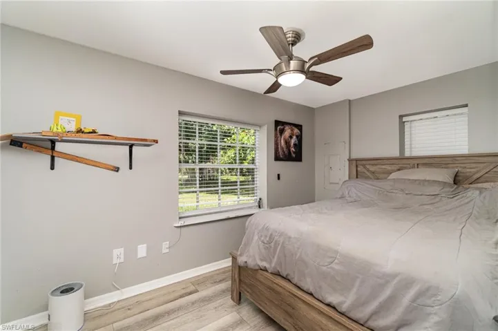 Bedroom 2 with ceiling fan and light hardwood / wood-style floors