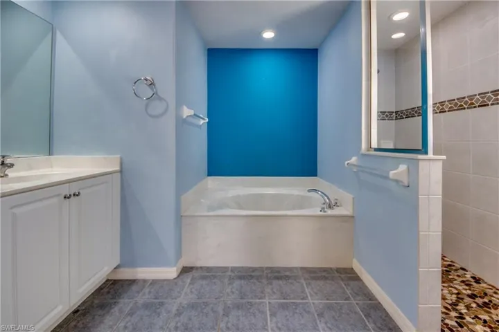 Bathroom with independent shower and bath and vanity
