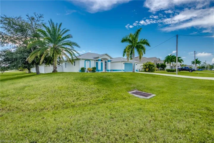 Single story home with a front yard