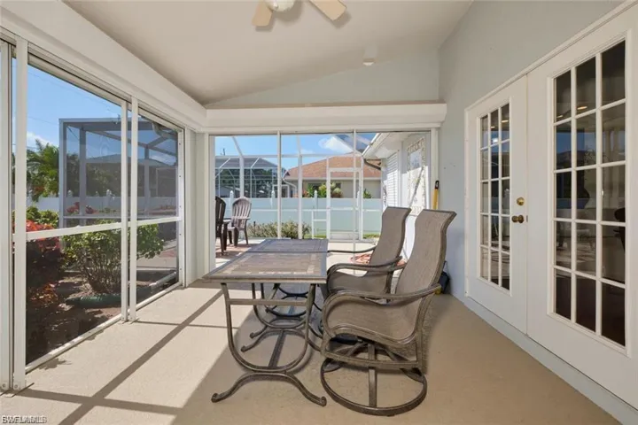 Sunroom / solarium with french doors and lofted ceiling