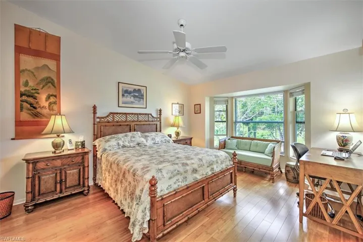 Primary bedroom with golf course views.