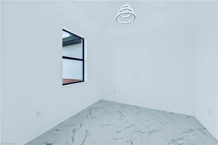 Spare room with a chandelier