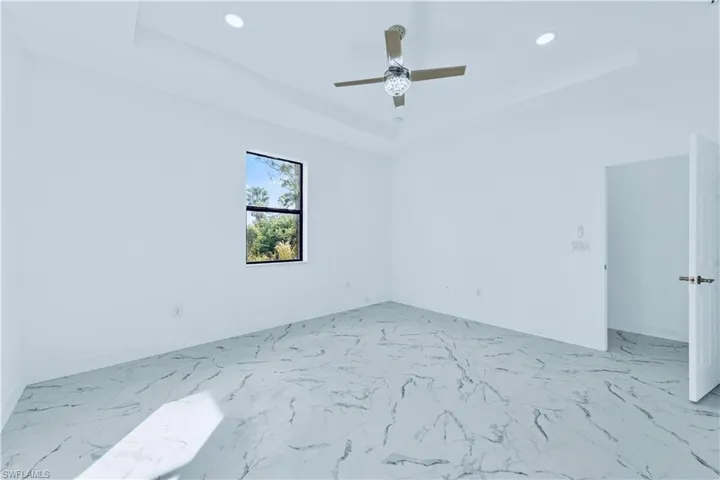 Unfurnished room featuring ceiling fan