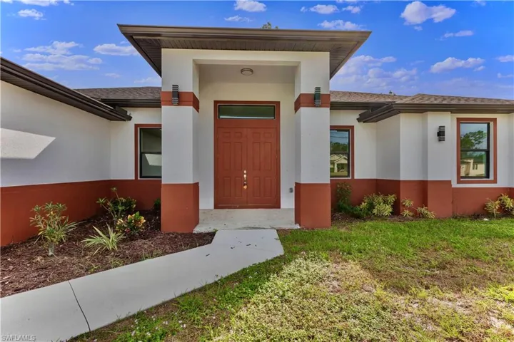 Property entrance featuring a yard