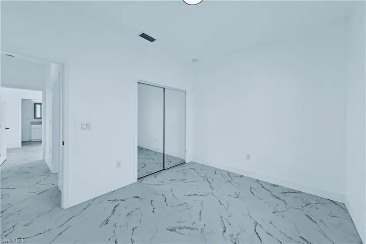 Unfurnished bedroom featuring a closet
