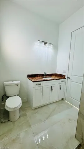 Bathroom with vanity and toilet