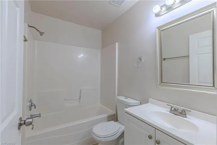 Full bathroom featuring vanity and shower / tub combination