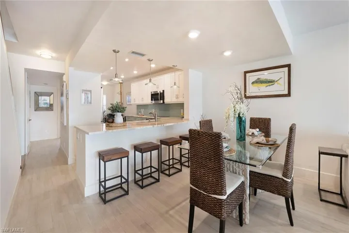 Dining area featuring light wood-type flooring and recessed lighting