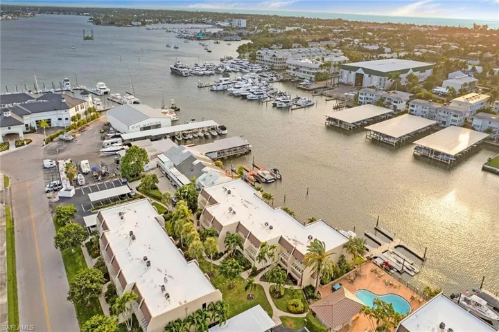 Bird's eye view of a nearby body of water and numerous boat docks