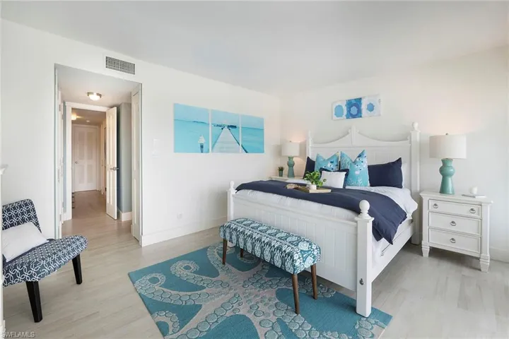 Bedroom with light wood-style flooring and baseboards