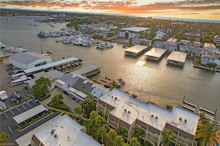 Drone / aerial view of a large body of water and numerous boat docks