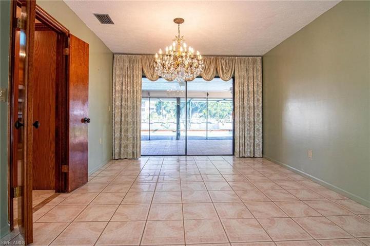Large Dining area overlooks the pool lanai.