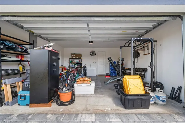 Garage featuring refrigerator