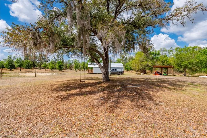 View of yard featuring a detached carport