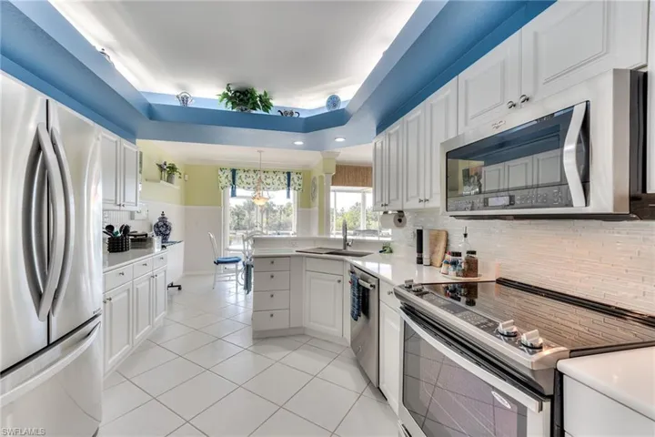 KITCHEN FEATURES STAINLESS STEEL APPLIANCES, BEAD BOARD, QUARTZ COUNTERTOPS