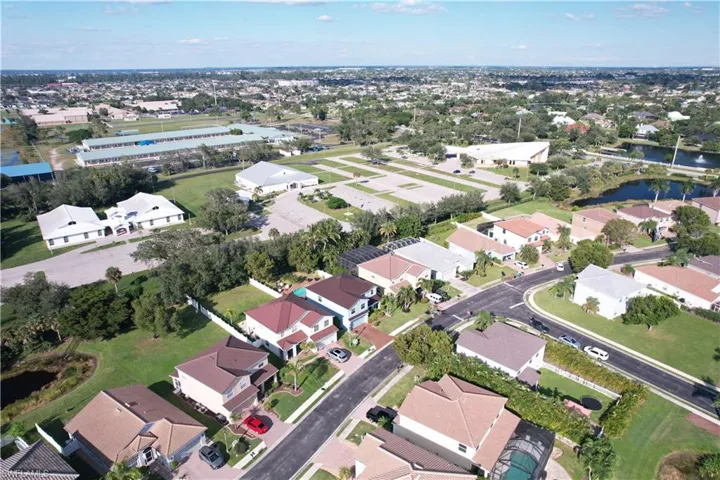 Aerial overview of property's location with nearby suburban area