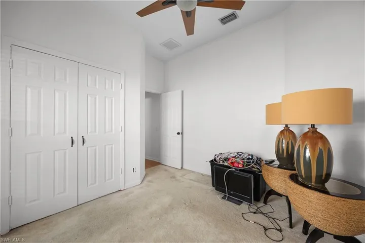 Sitting room with carpet floors and ceiling fan