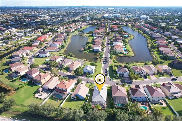 View of property location with a large body of water and nearby suburban area