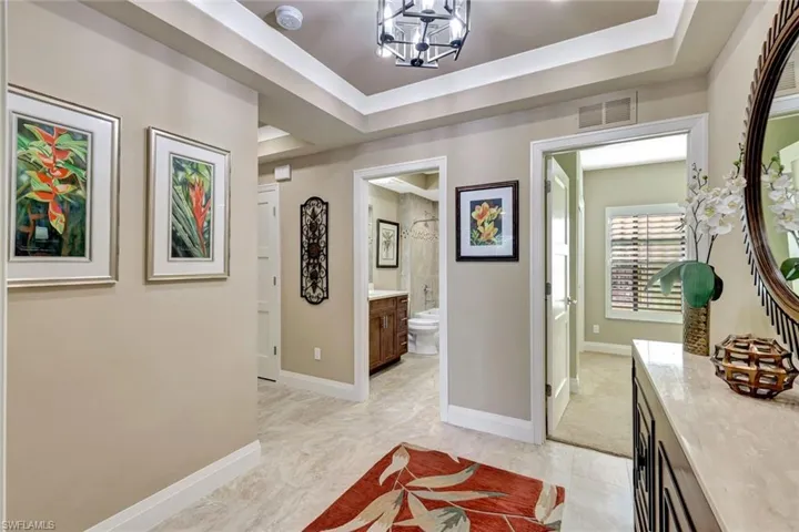 spacious hall with three adjacent bedroom suites.