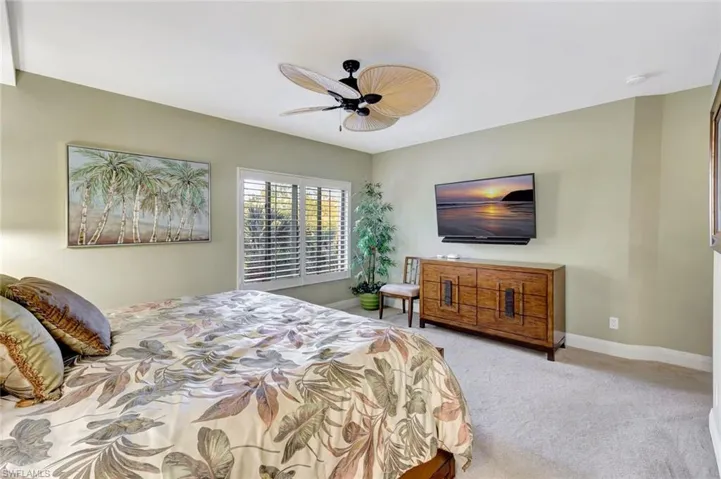 Master Bedroom with large tv and cradenza