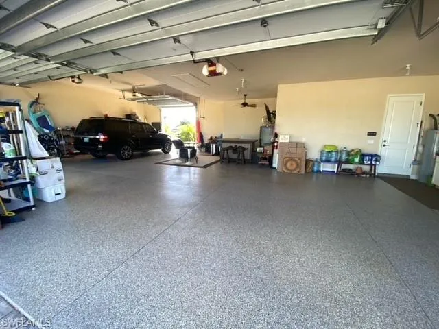 Garage featuring a garage door opener