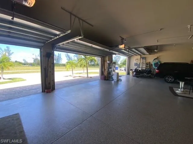 Garage featuring a garage door opener