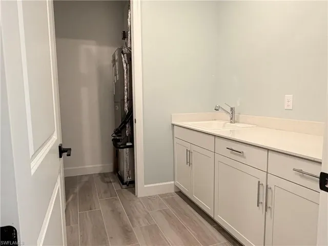 Upgraded Laundry with storage and sink.