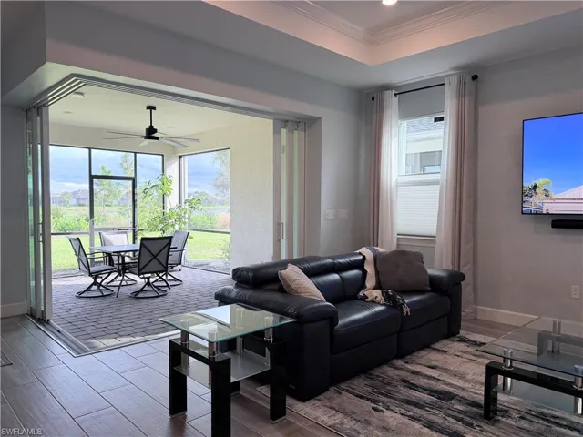 Living Room with Zero Corner Sliders onto screened in Lanai