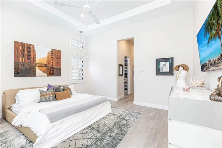 Master Bedroom featuring ornamental molding, light wood finished floors, baseboards, recessed lighting, and a ceiling fan
